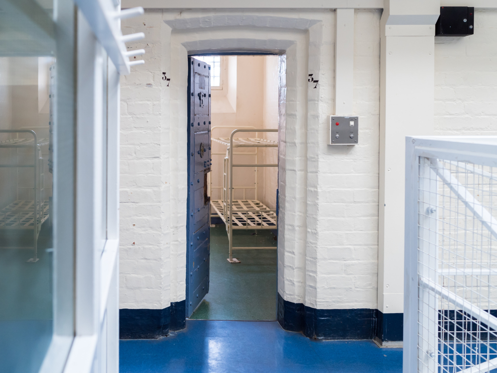 A prison cellwith two bunk beds.